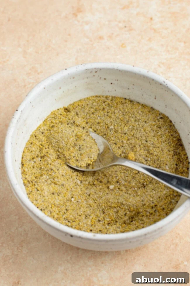 A close-up of a vibrant spice blend, ready to be applied as a dry rub for the turkey, showcasing the rich colors and textures of the seasonings.