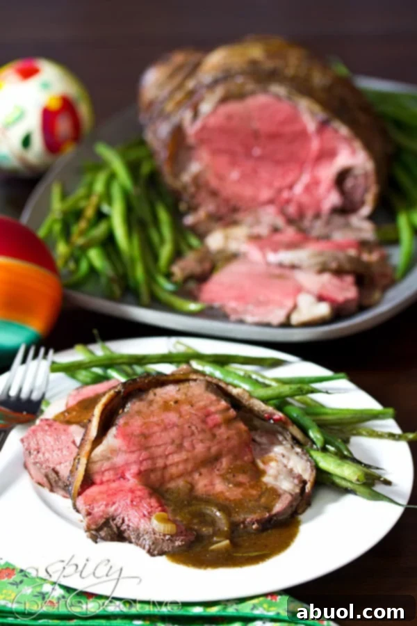 Beef Tenderloin Recipe with Balsamic Glaze - sliced on plate with a side dish