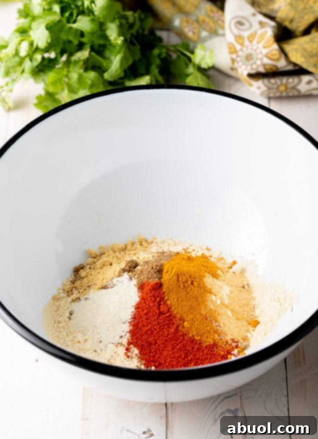 Crispy Kale and Vegetable Pakora 6 White bowl with various spices.