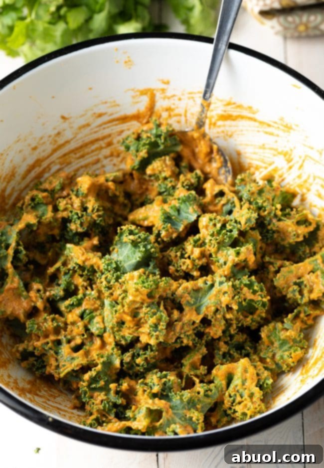 Crispy Kale and Vegetable Pakora 9 A mixture of raw kale and seasonings in a white bowl.