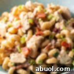 chicken bacon ranch pasta in light blue bowl, close up, showing all ingredients