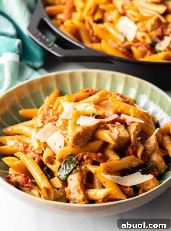 A second inviting green bowlful of Marry Me Chicken Pasta, highlighting its rich, creamy texture and vibrant ingredients.