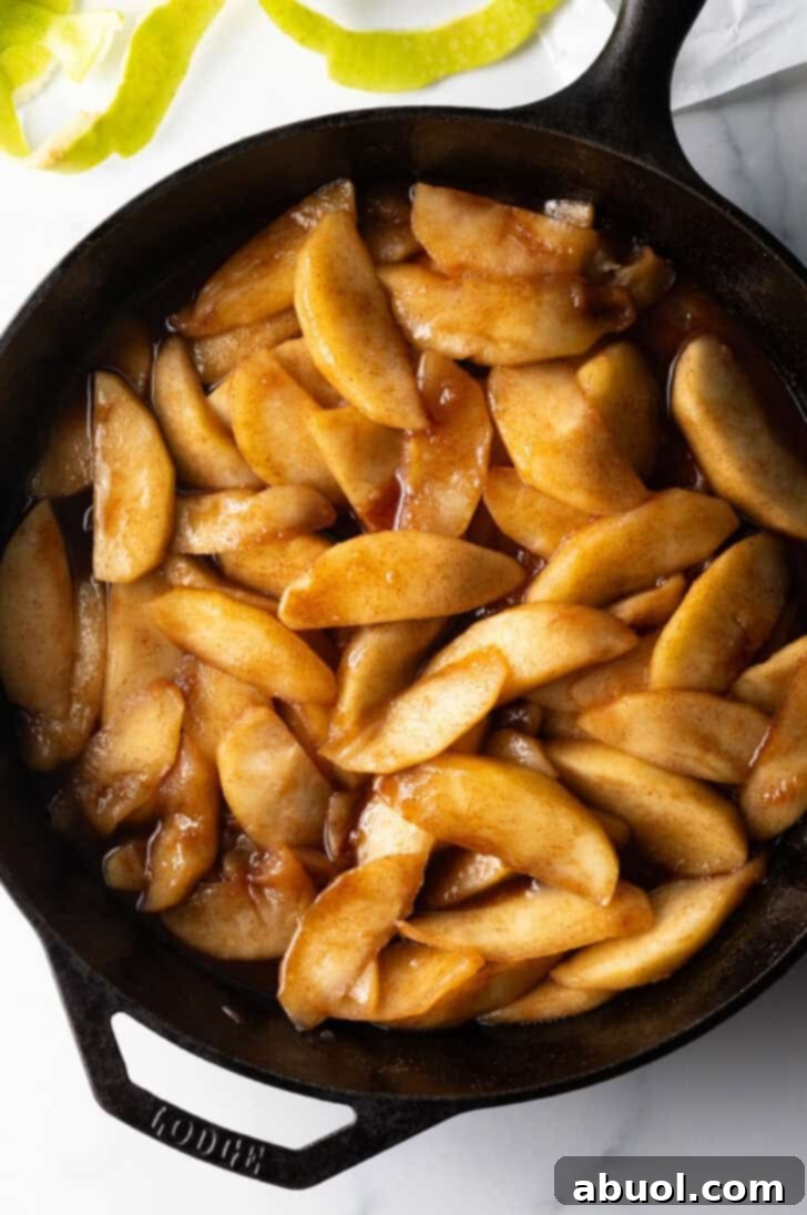 Cast iron skillet with spiced fried apples.