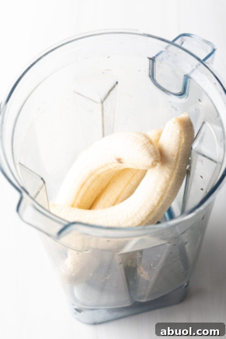 Three ripe bananas ready to be blended for banana bread.