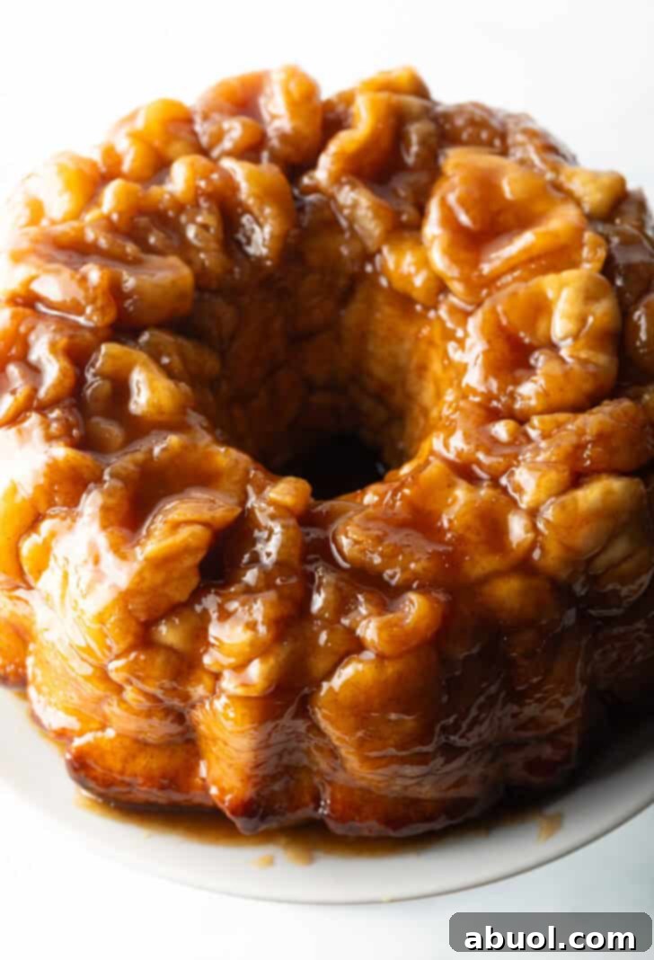 Irresistible Pull-Apart Cinnamon Loaf 2 Top down view baked bundt monkey bread with bourbon syrup.
