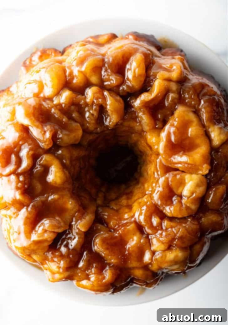 Irresistible Pull-Apart Cinnamon Loaf 14 Top down view baked bundt monkey bread with bourbon syrup.