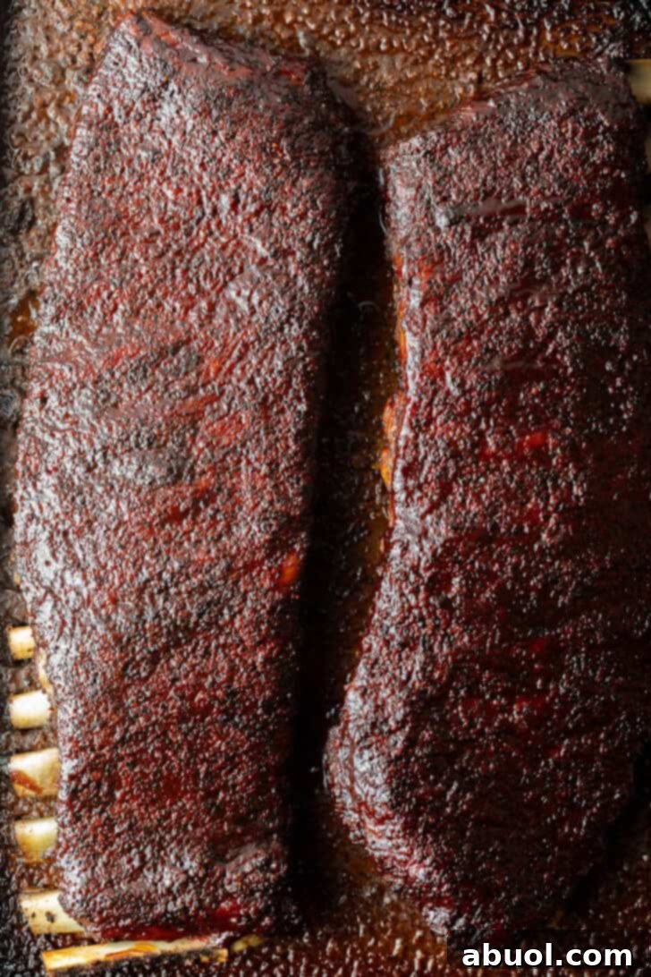 Ultimate St Louis Pork Ribs 4 Two full racks of St Louis pork ribs on cooking tray.