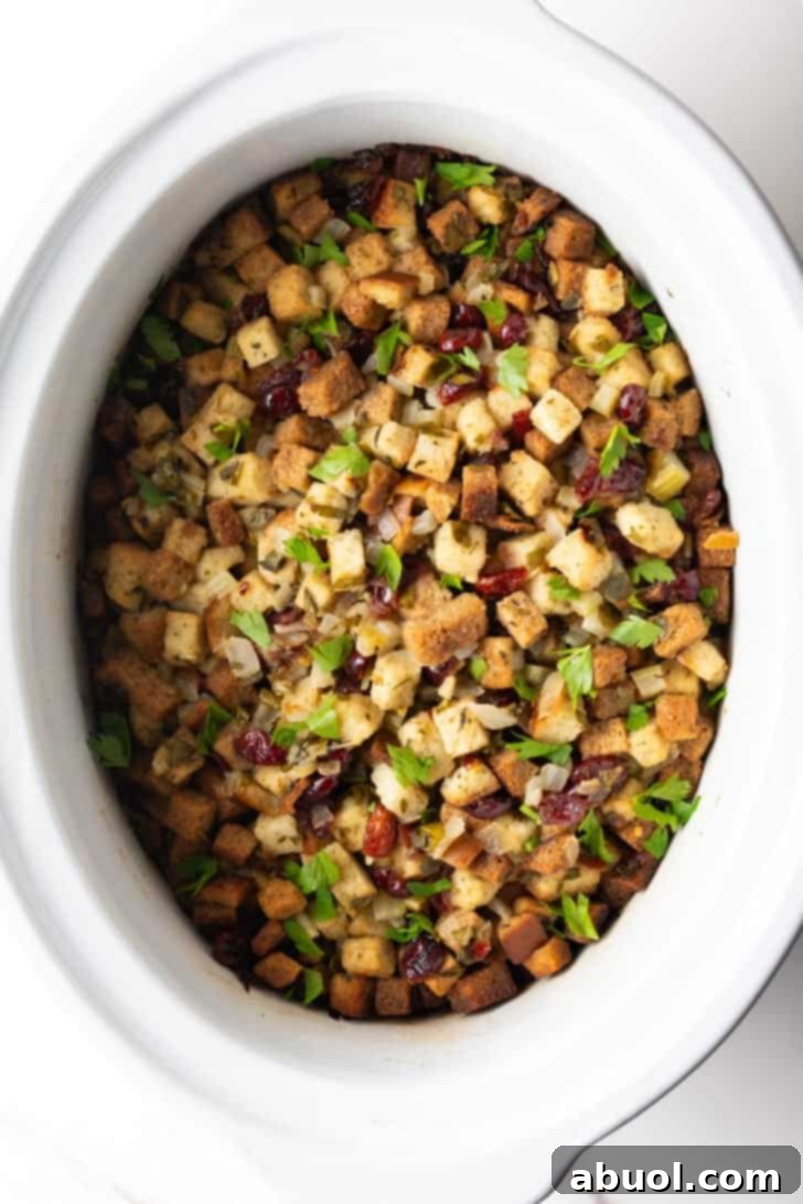 Overhead view of crock pot dressing in a white crock pot.