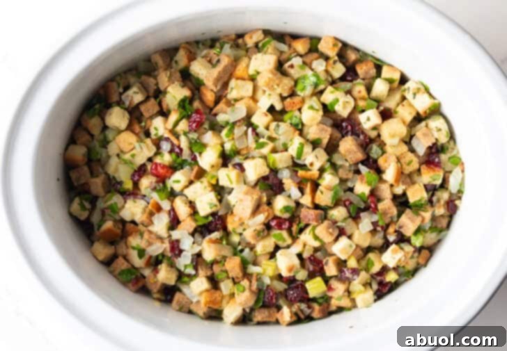 Crock pot dressing fully assembled and ready to be cooked in the slow cooker.