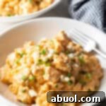 White bowl of creamy cheesy buffalo chicken mac n cheese.