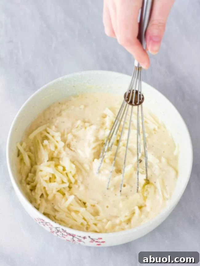 Korean Jeon: Savory Delights 5 A mixing bowl filled with the light and airy Korean pancake batter, being gently whisked to achieve the perfect consistency before the vegetables are added.