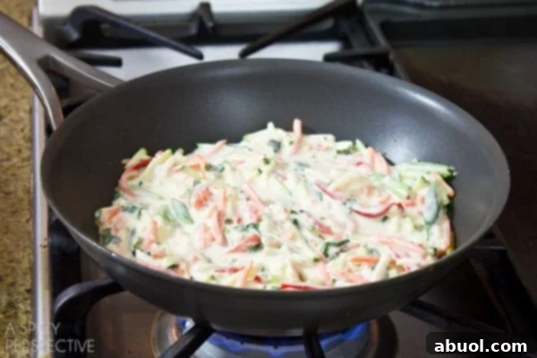 Korean Jeon: Savory Delights 6 Golden-brown Korean pancakes sizzling gently in a hot non-stick pan, showcasing the crisping process and rich texture as they cook.