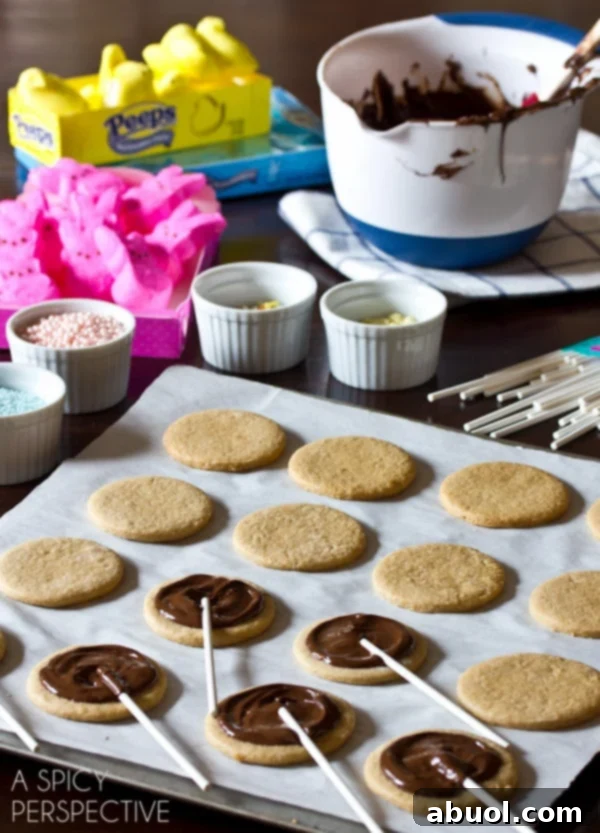 Easy Easter S'mores Cookies on a stick - A close up of a finished Easter S'mores cookie pop, showing the melted chocolate and Peep.