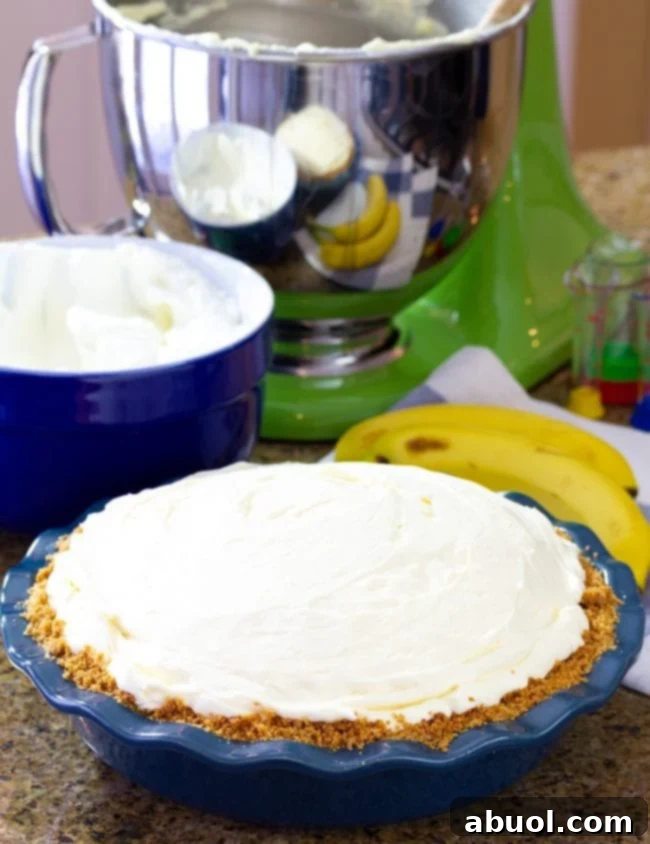 Graham cracker crust filled with the creamy banana pie filling and topped with generous dollops of whipped cream.