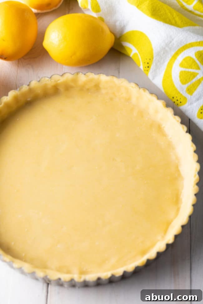 Lemon Tart crust pressed into a tart pan.