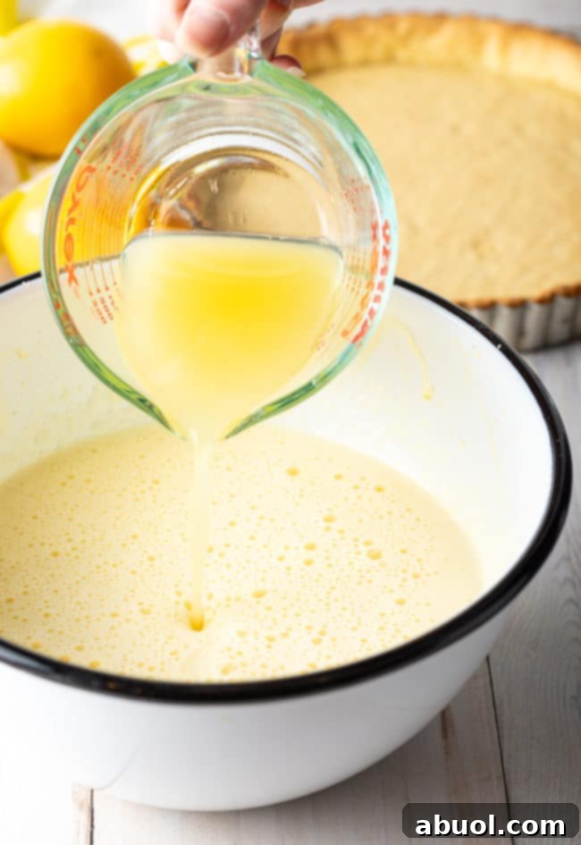 Making Curd Recipe for Meyer Lemon Tart in large mixing bowl.