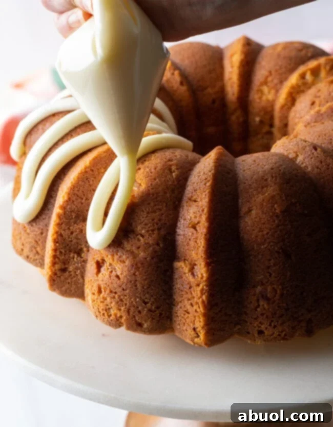 peach bundt cake close up with glaze icing
