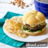 A perfectly cooked Mediterranean burger patty with fresh ingredients, ready to be assembled.