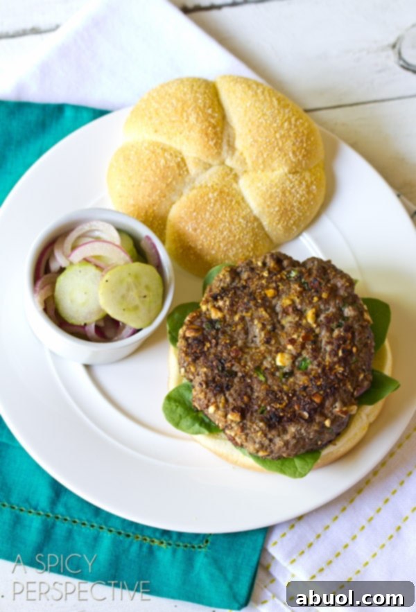 A single Mediterranean burger resting elegantly on a plate, ready to be enjoyed, showcasing its thoughtful presentation.