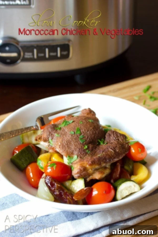 Vibrant Slow Cooker Moroccan Chicken dish, garnished with fresh herbs