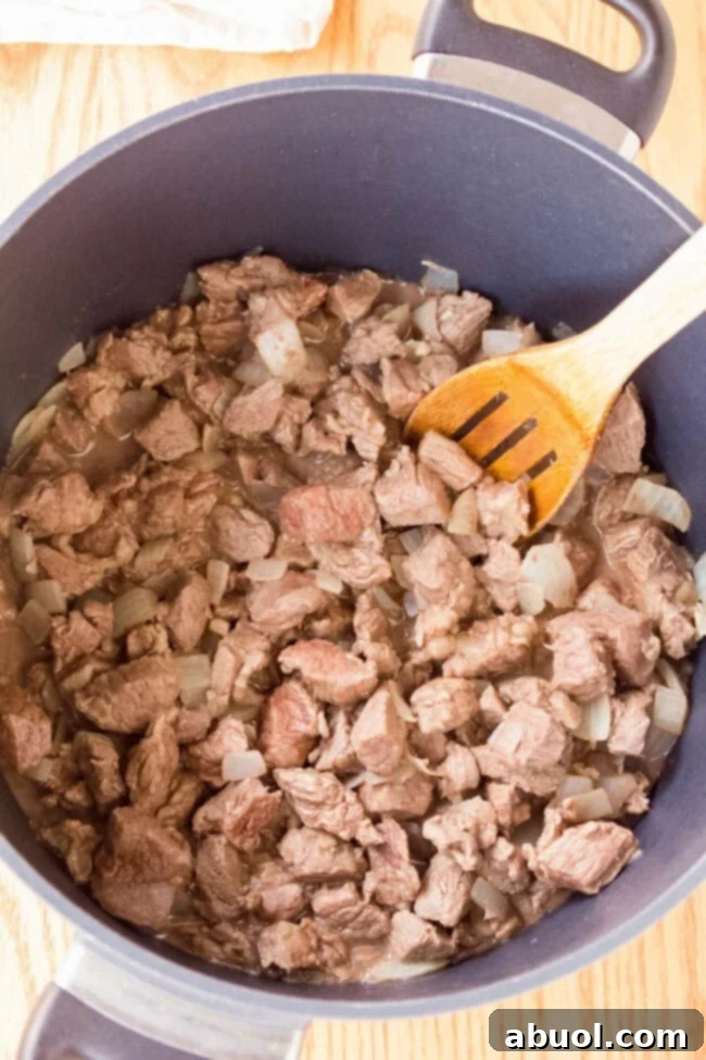 Cook the beef chuck meat on the stove in a large pot