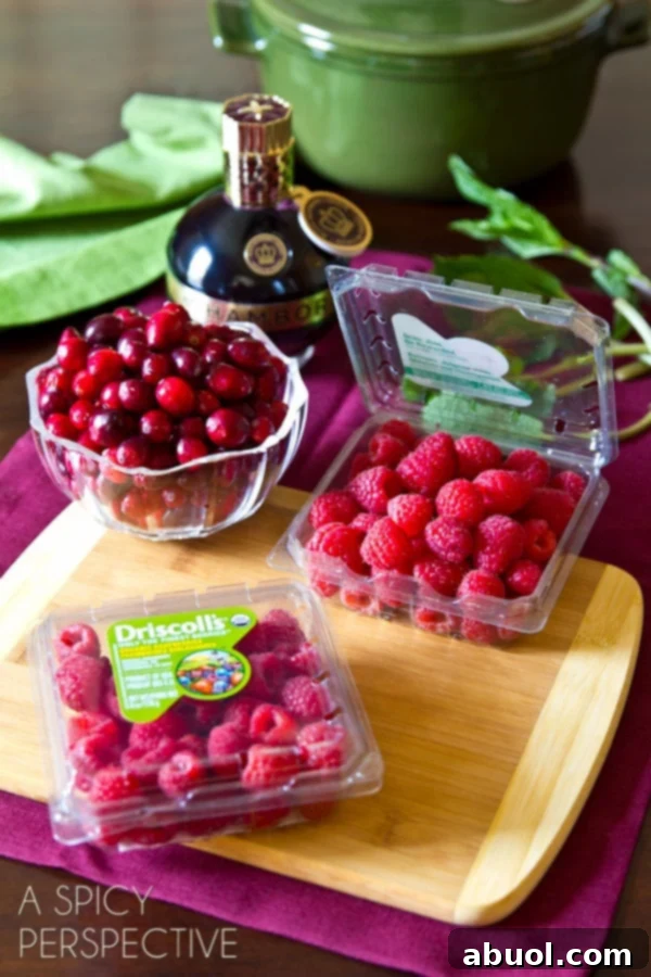 A basket of fresh, plump Driscoll's raspberries, showcasing their quality and vibrant color.