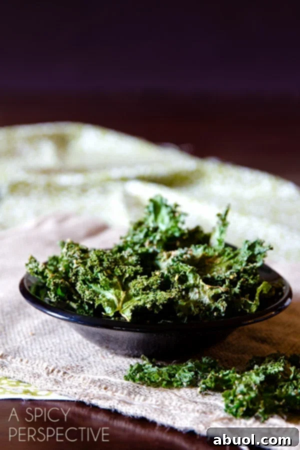 Baked kale chips in a small bowl.