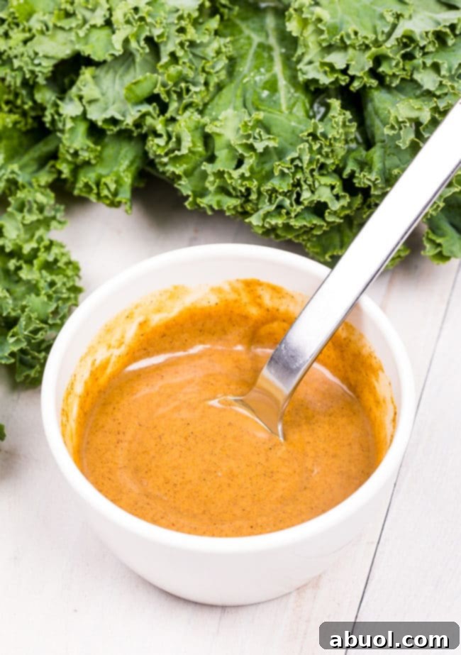 Blended almond butter and spices in a bowl.