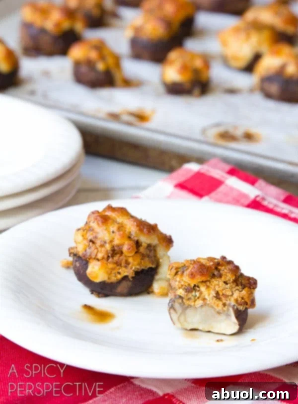 A large platter of Chorizo and Cheese Stuffed Mushrooms, ready for a party.