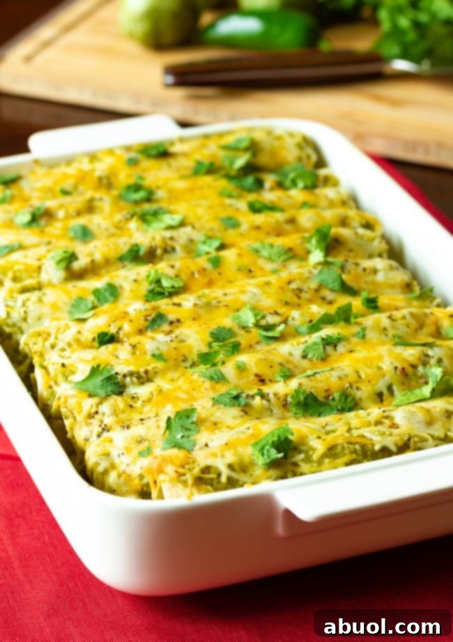 Zesty Salsa Verde Enchiladas 4 Casserole dish filled with this baked recipe covered in golden, melted cheese.