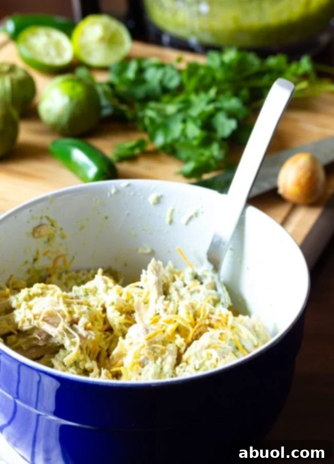 Zesty Salsa Verde Enchiladas 9 A closer view of the creamy chicken enchilada recipe filling in a bowl.