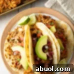 A delicious Slow Cooker Carnitas Recipe, perfect for tacos, burritos, or rice bowls.