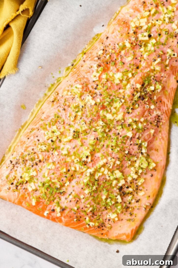 Raw salmon covered in marinade before being baked. 