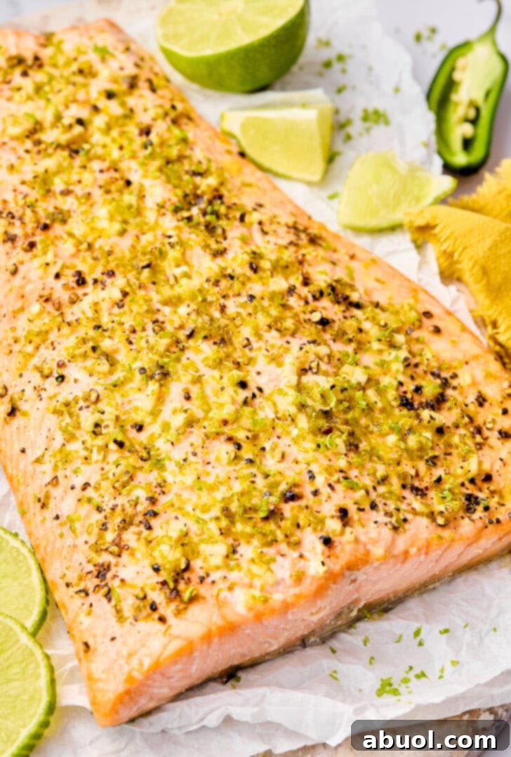 Oven Salmon Recipe with lime and jalapenos on plate.