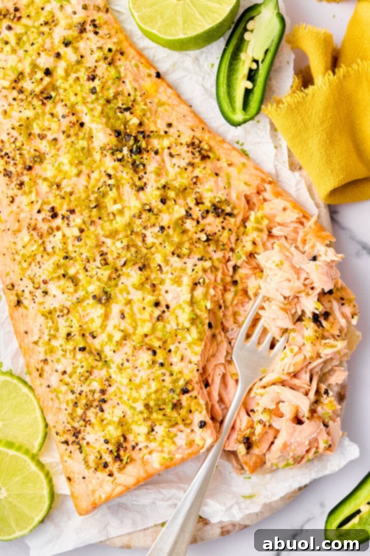 Oven Baked Salmon with spices, cut open with fork.
