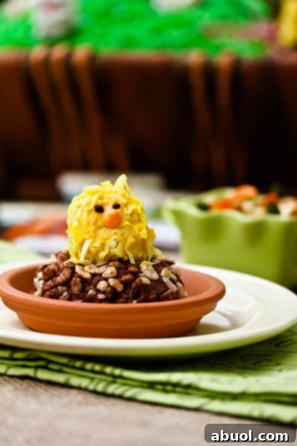 Overhead shot of an Easter centerpiece featuring a Cocoa Krispies garden with edible carrots and bunnies, surrounded by spring treats