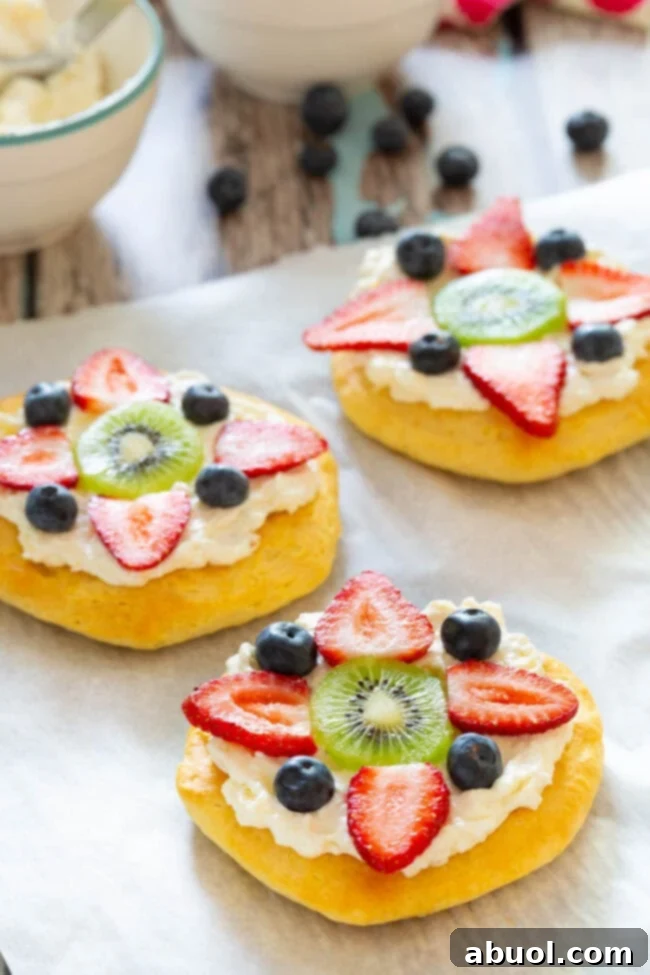 Breakfast pizza on baking sheet - close up shot with an assortment of berries on top.