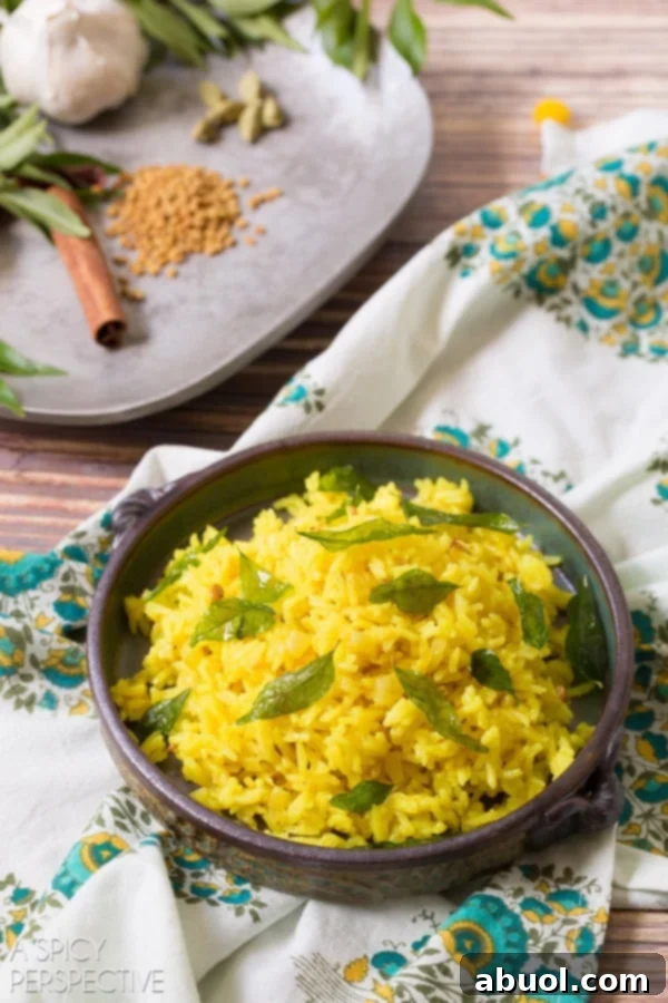 Indian rice plated in a bowl, showcasing its beautiful texture and vibrant spices.