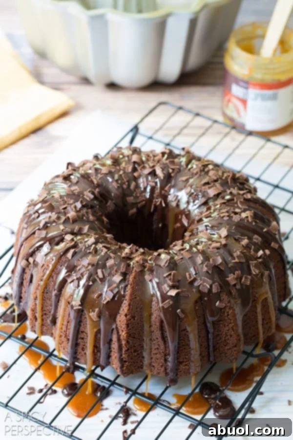Boozy Baileys Bundt Bliss 8 Decorated Baileys Irish Cream Bundt Cake adorned with delicate chocolate shavings.