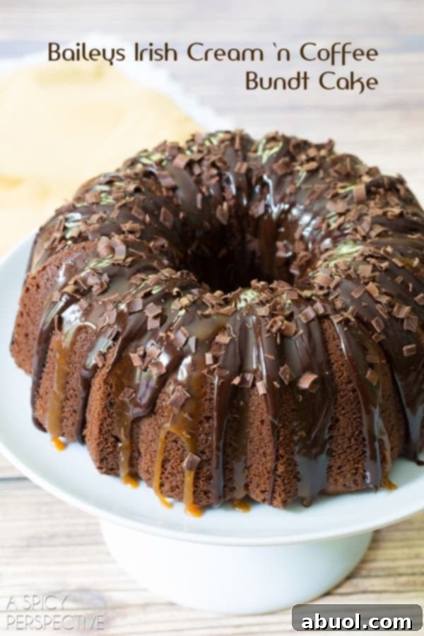 Boozy Baileys Bundt Bliss 9 Closeup shot of the Baileys Irish Cream Bundt Cake on a decorative platter, highlighting its intricate design and glossy topping.