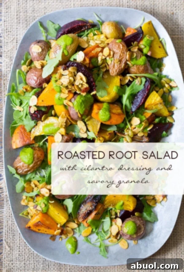 Roasted Root Vegetables Salad topped with granola and cilantro dressing on a serving platter, showcasing rich autumnal colors.