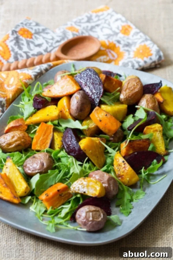 Roasted Root Vegetable Salad presented beautifully on a large serving platter, ready to be enjoyed.