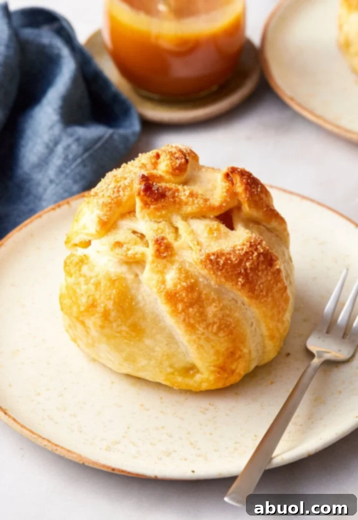 Baked apple pie bomb after being baked on a plate ready to serve.
