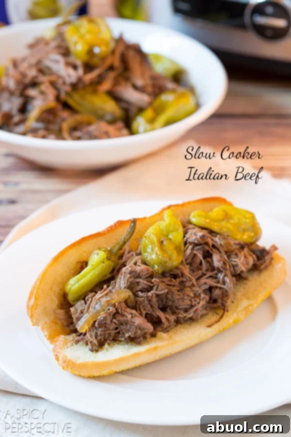 Tender Slow Cooker Italian Beef piled high in toasted sub rolls, ready to be enjoyed.