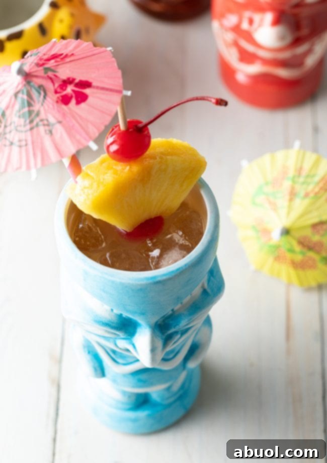 Out-of-this-World Out of this World Cocktail - A beautifully garnished Mai Tai, ready to enjoy.