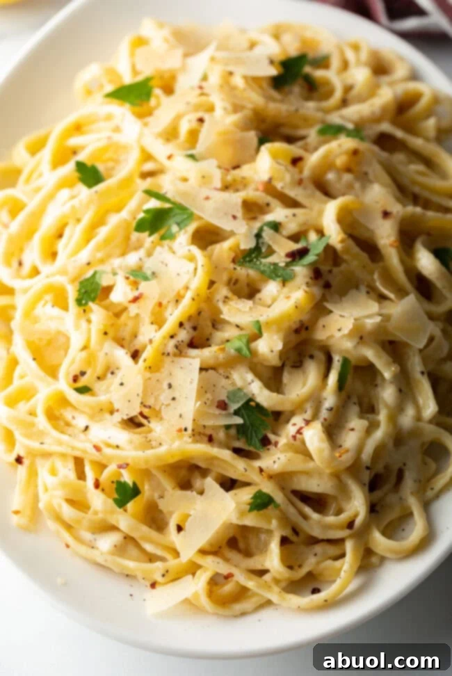 Classic Fettuccine Alfredo Recipe - Overhead close up of creamy pasta dish
