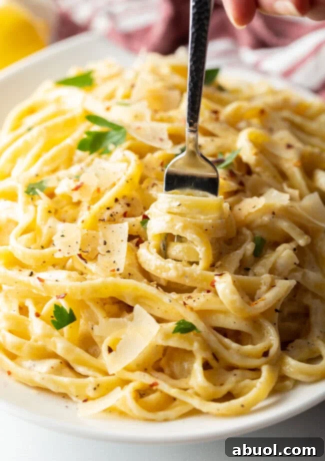 Creamy Alfredo sauce with festive Christmas fettuccine pasta