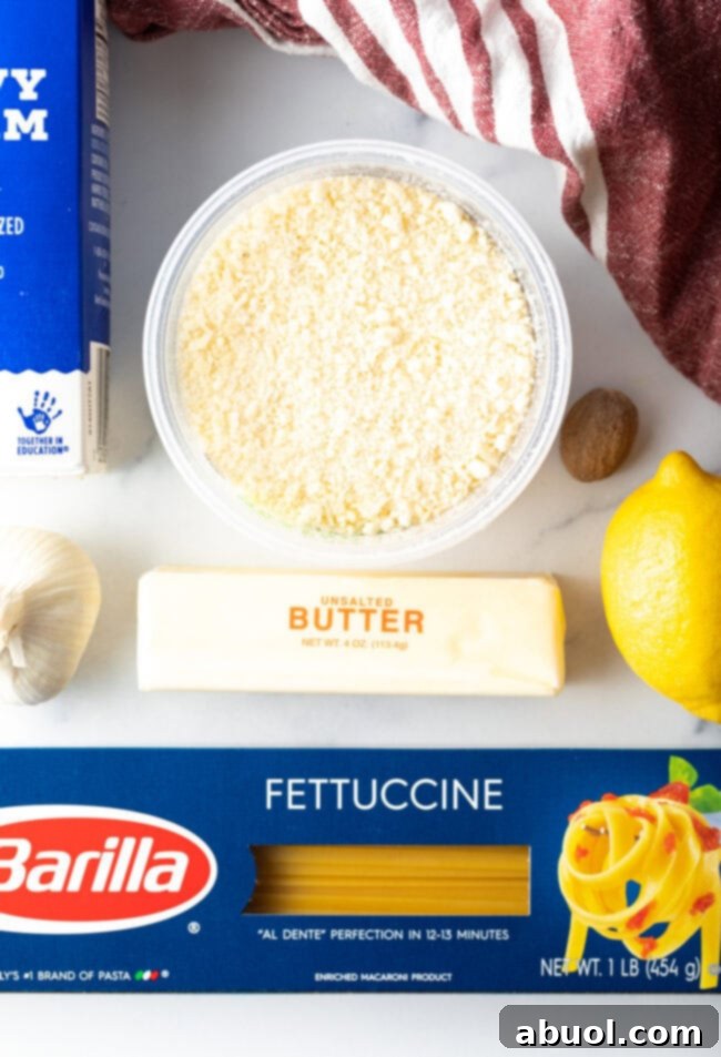 Ingredients for creamy Alfredo sauce displayed beautifully