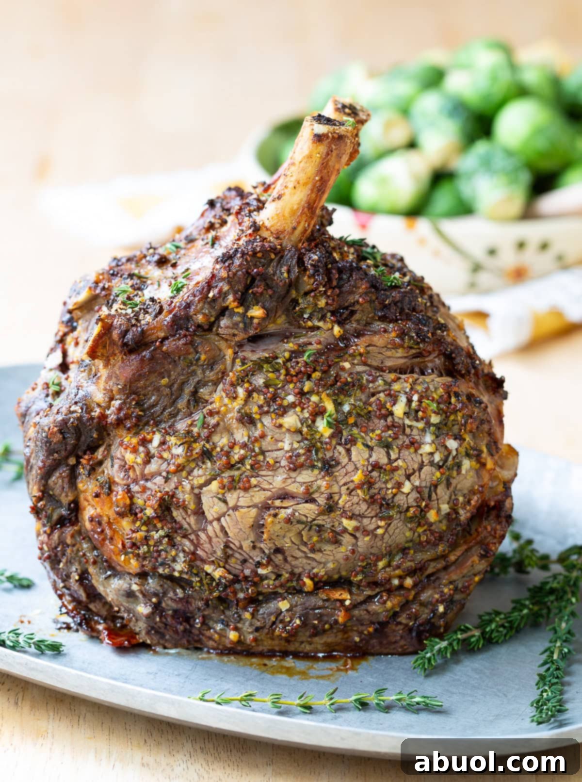 A beautifully roasted standing rib roast, seasoned with a perfect rub, ready to be carved for a festive meal.