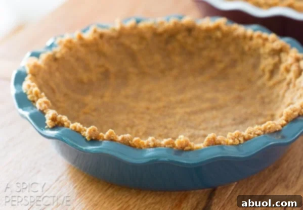 Lemon pie graham cracker crust ready to bake, showing even press.